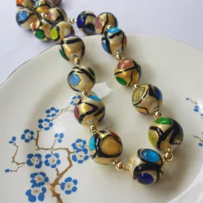 Necklace with multicolours, black and gold Murano glass medium sphere beads on gold